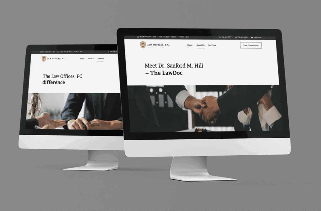 Two computer monitors display a law office website—one with a business handshake, the other showing a professional meeting. Both screens highlight Dr. Sanford M. Hill and showcase effective law firm branding with Atlanta website design expertise.