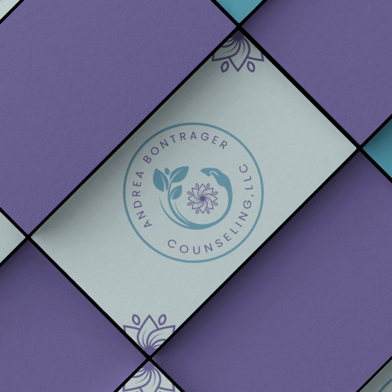 A logo design for Andrea Bontrager Counseling, LLC, featuring a circular motif with leaves and abstract floral elements, is displayed among overlapping purple and light blue paper squares for this counseling service.
