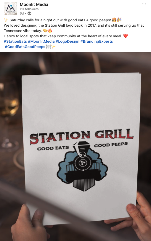How to Turn 2025 Highlights into 2026 Marketing Content. A person holds a printed menu or poster with the Station Grill logo, featuring train imagery and the tagline Good Eats Good Peeps—perfect for marketing content or 2025 highlights. The scene is indoors with a blurred table in the background.
