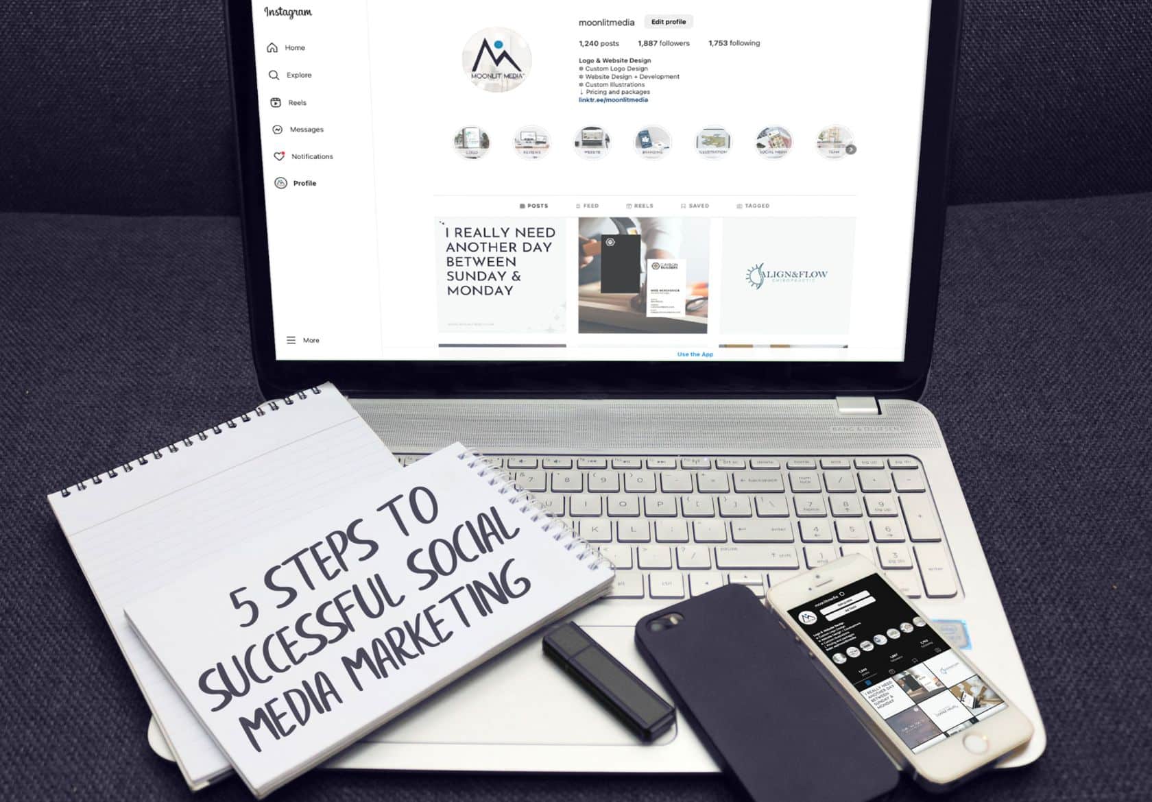 A notebook with “5 Steps to Successful Social Media Marketing” rests on a laptop displaying an Instagram page, alongside a smartphone and pen—perfect inspiration for businesses seeking web design services or custom website design by Moonlit Media.