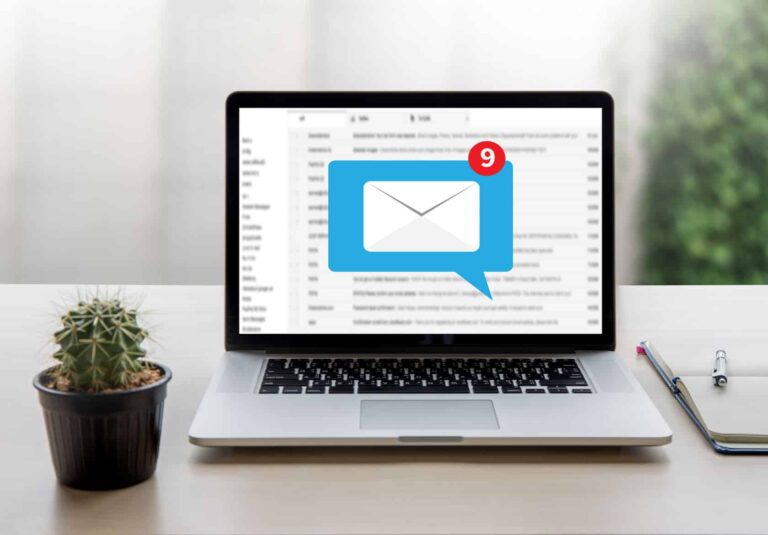 A laptop on a desk displays an email inbox with 9 new messages—perhaps from clients seeking custom website design. Next to the laptop are a small potted cactus, a pen, and a notepad.