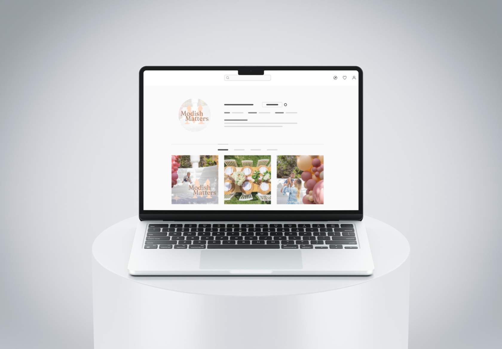 A laptop on a white round table displays a social media profile page for Modish Matters, featuring event decorations, balloons, and posts about logo design services by Moonlit Media.