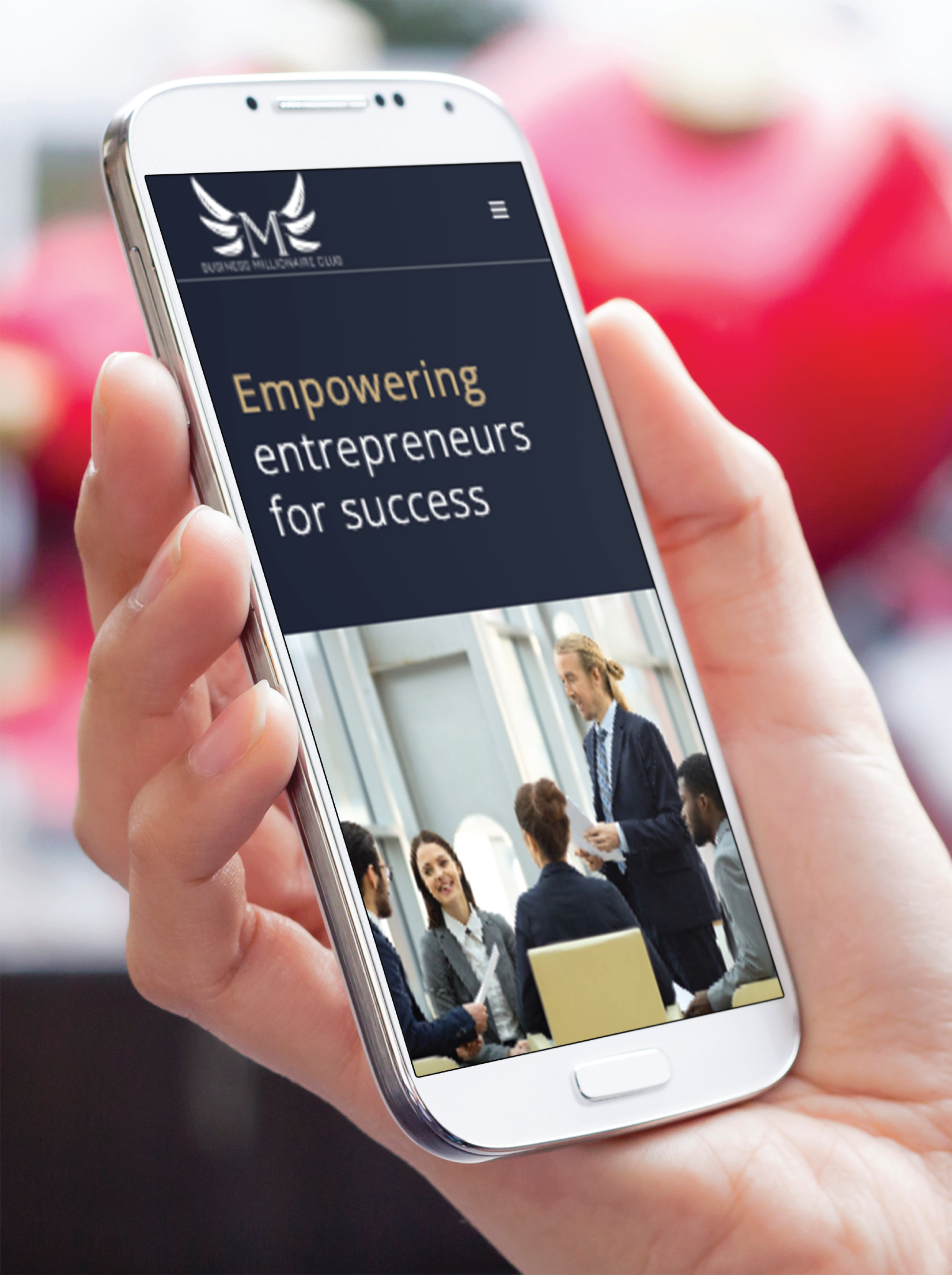 A hand holds a smartphone displaying a website that reads Empowering entrepreneurs for success above an image of people in business attire having a meeting, showcasing expert Website Design and Branding.