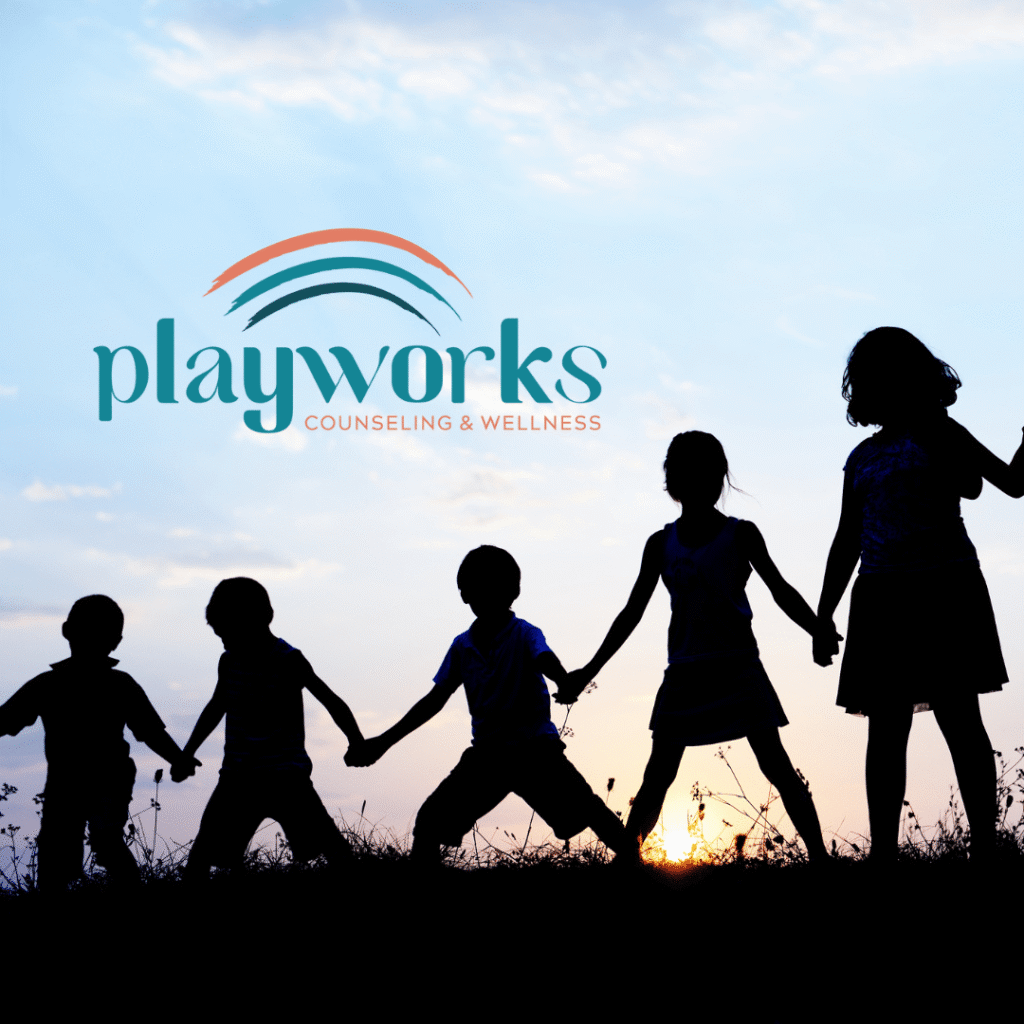 Five children holding hands in a grassy field at sunset, with the Playworks Counseling & Wellness logo—crafted by Moonlit Media’s logo design services—shining above them in the sky.
