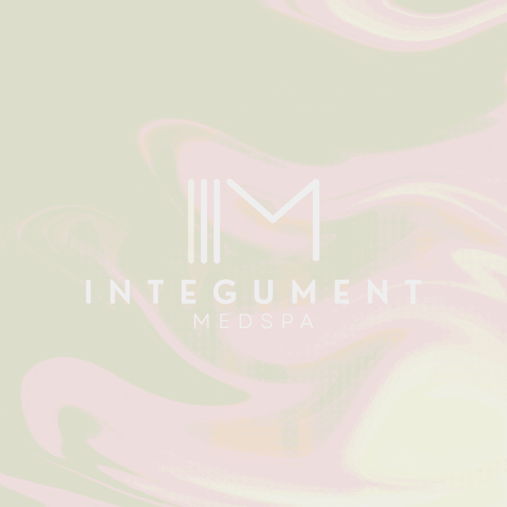 Logo for Integument Medspa with a stylized IM above the business name, set against a soft, cream-colored, marble-like background—perfect for showcasing on your custom website design by Moonlit Media.