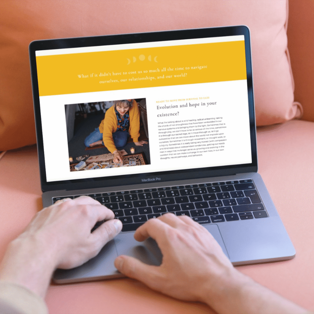 A web designer types on a MacBook Pro. The screen displays a moonlit media website with a yellow header, a photo of a woman sitting on the floor, and an article titled Evolution and hope in your existence?.