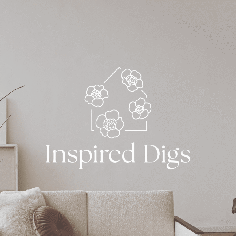 A minimalist custom logo design with floral line art in the shape of a house above the text Inspired Digs, set against a neutral-toned living room background—perfect for showcasing Moonlit Media’s web design services.
