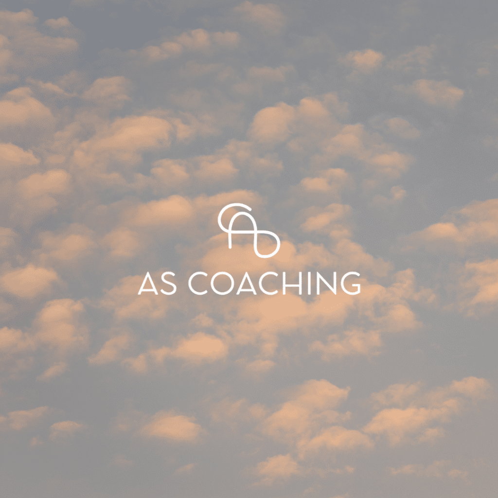 Light clouds scattered across a soft evening sky, with a minimalist white AS logo above the text AS COACHING—reflecting the clarity and elegance of custom website design by Moonlit Media.