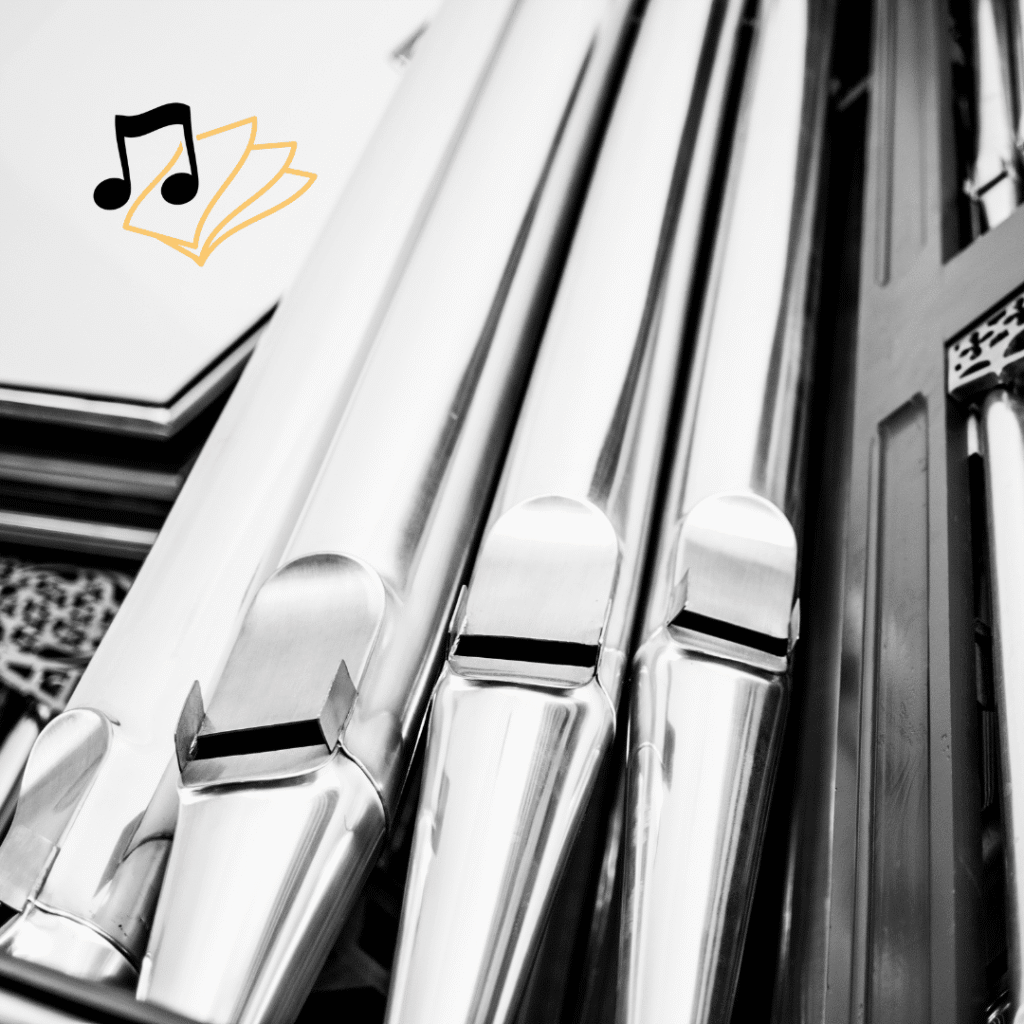 Close-up of shiny metal organ pipes in black and white, with a small icon in the top left showing musical notes and sheet music—perfect inspiration for a web designer seeking elegance and harmony in custom website design.