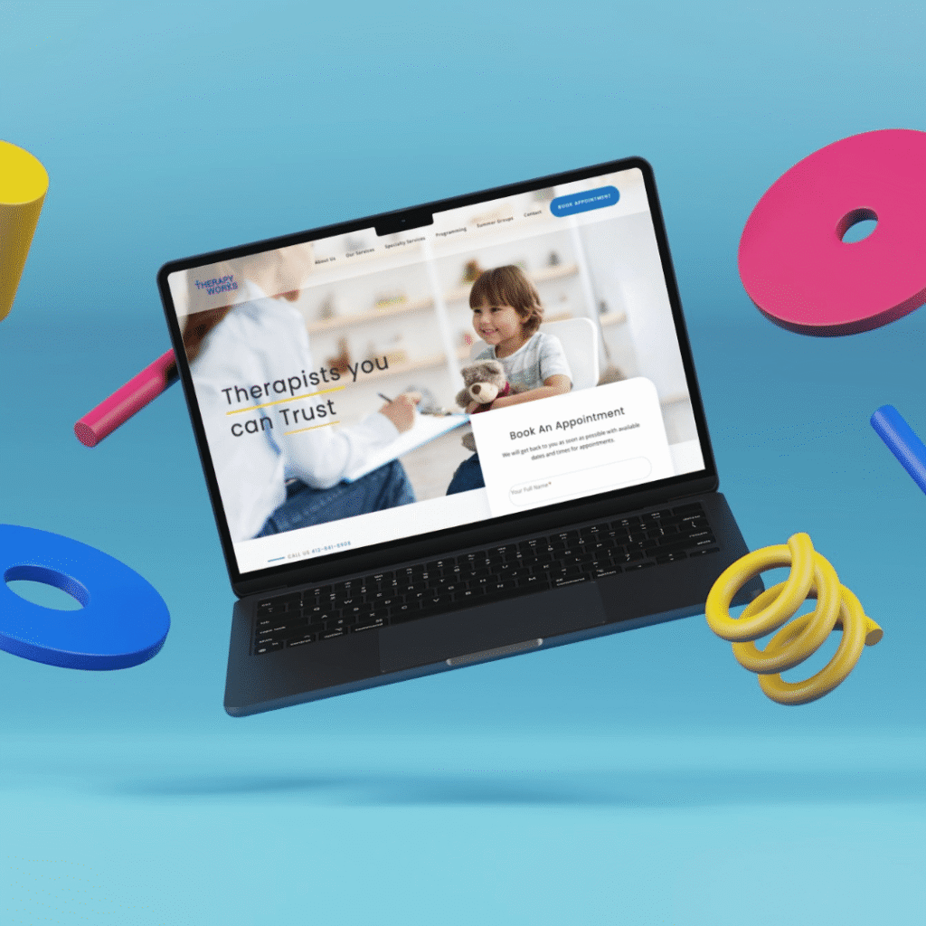 A laptop displaying a custom website design for therapy services floats against a blue background, surrounded by colorful, abstract 3D shapes like rings and cylinders.
