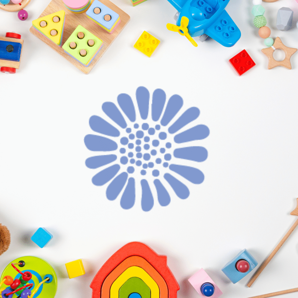 Colorful childrens toys, including blocks, a rainbow stacker, and a toy airplane, surround a blue flower-like abstract design—perfect inspiration for web designers or Moonlit Media seeking creative web design services.