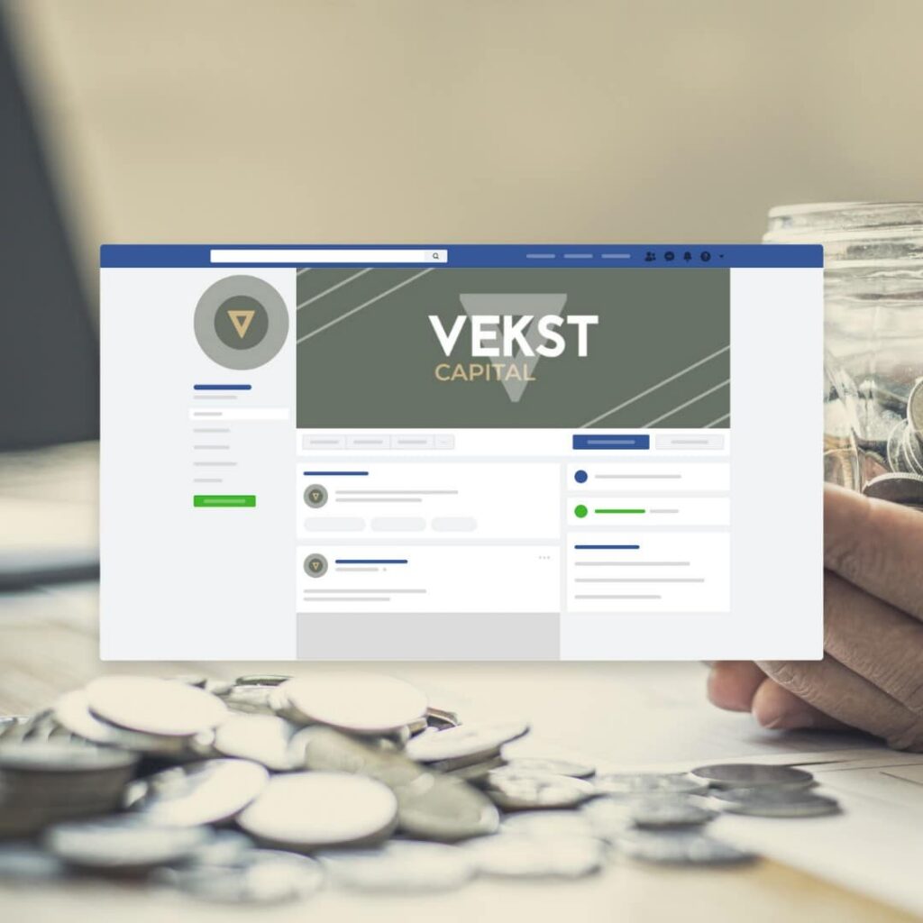 A hand holds a jar of coins near a laptop displaying Vekst Capital’s Facebook business page. More coins are scattered on the table—a fitting scene for a web designer seeking inspiration for custom website design projects.