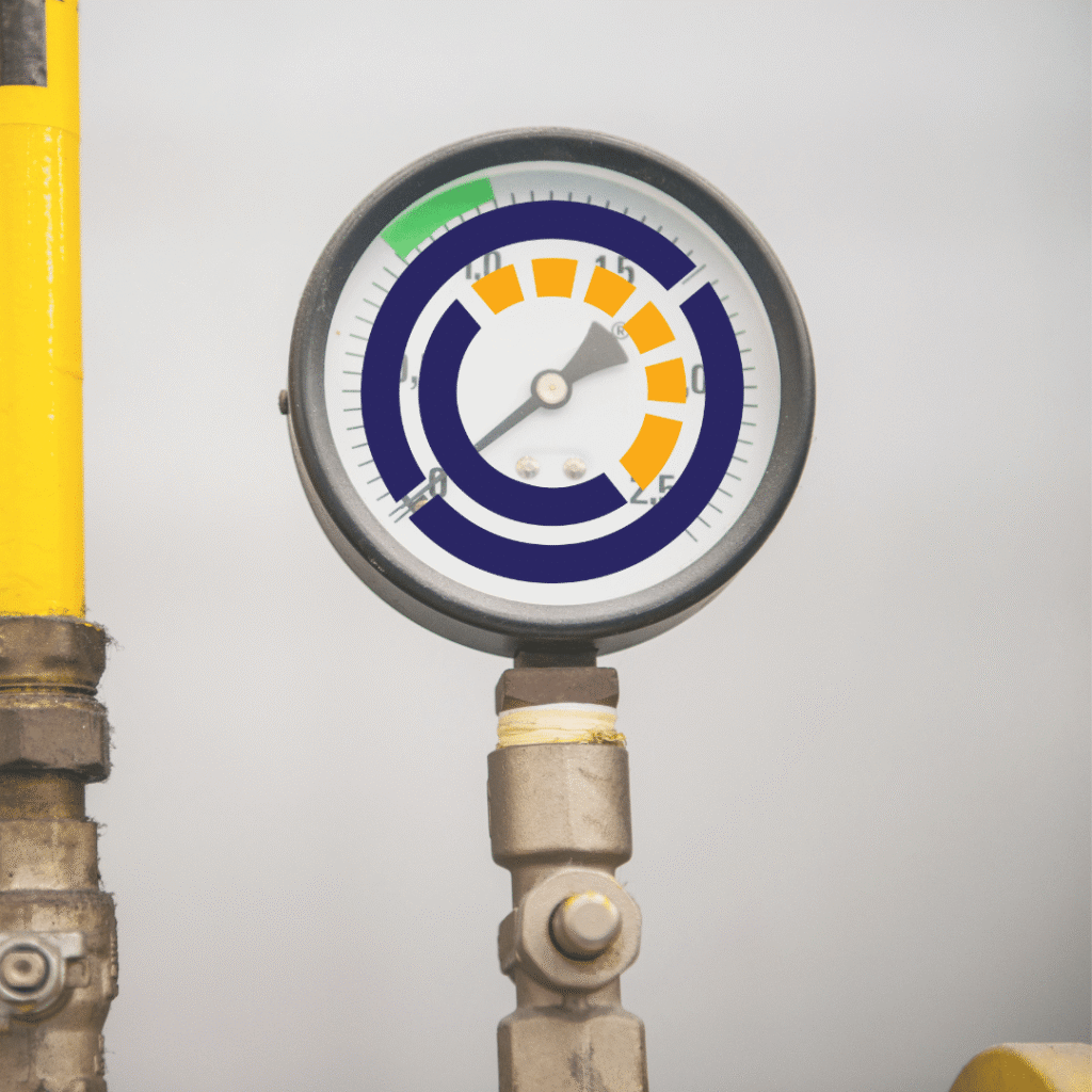 A close-up of an industrial pressure gauge with a colored digital overlay displaying levels in green, blue, and orange segments highlights precision—perfect for showcasing web design services. The gauge is attached to metal pipes, with a yellow pipe on the left.