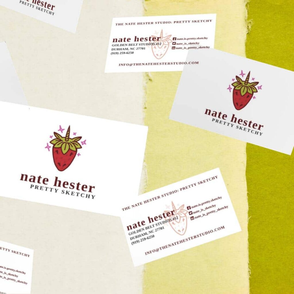 Business cards for Nate Hester Pretty Sketchy, a web designer, are scattered on a textured yellow and green background. The cards feature a whimsical strawberry illustration and contact information.
