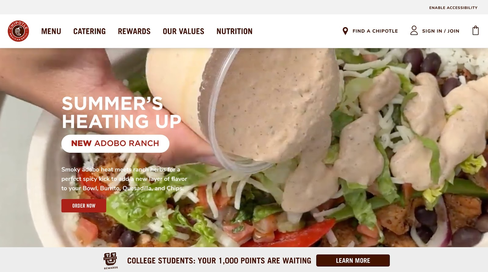 A close-up of a bowl of salad being drizzled with creamy dressing, with text promoting a new Adobo Ranch item and Chipotle’s menu, catering, rewards, nutrition options, plus logo design services featured in the website header.