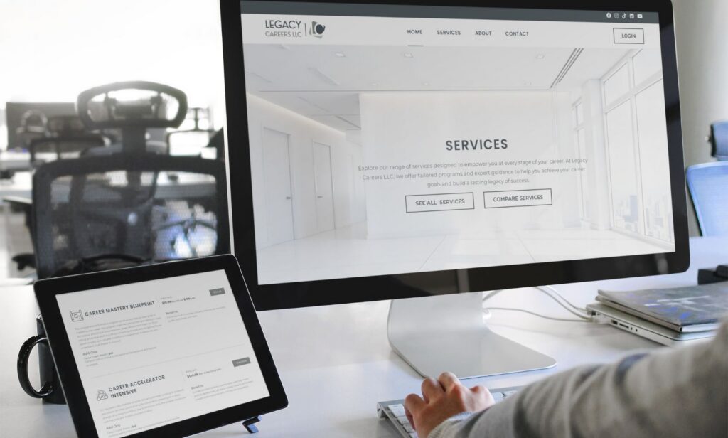 A man using a laptop and tablet, reviewing a Career Services Platform website design aimed at improving job search strategies.