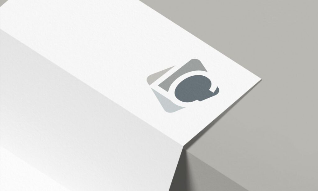 A minimalist white paperdisplaying a stylish logo, emphasizing a refined letterhead design.