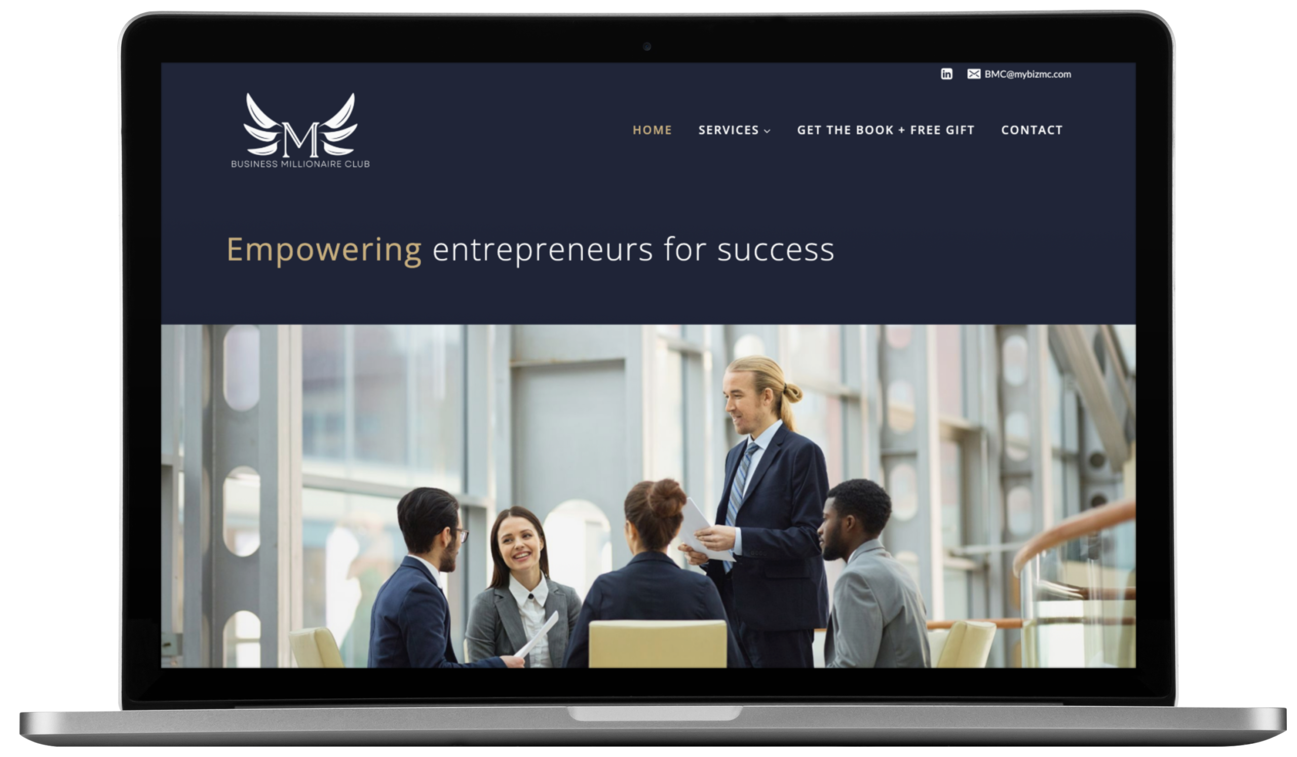 A laptop screen displays a website for the Business Millionaire Club. The homepage highlights expert website design and branding, featuring a group of professionally dressed people in a meeting and the text Empowering entrepreneurs for success.