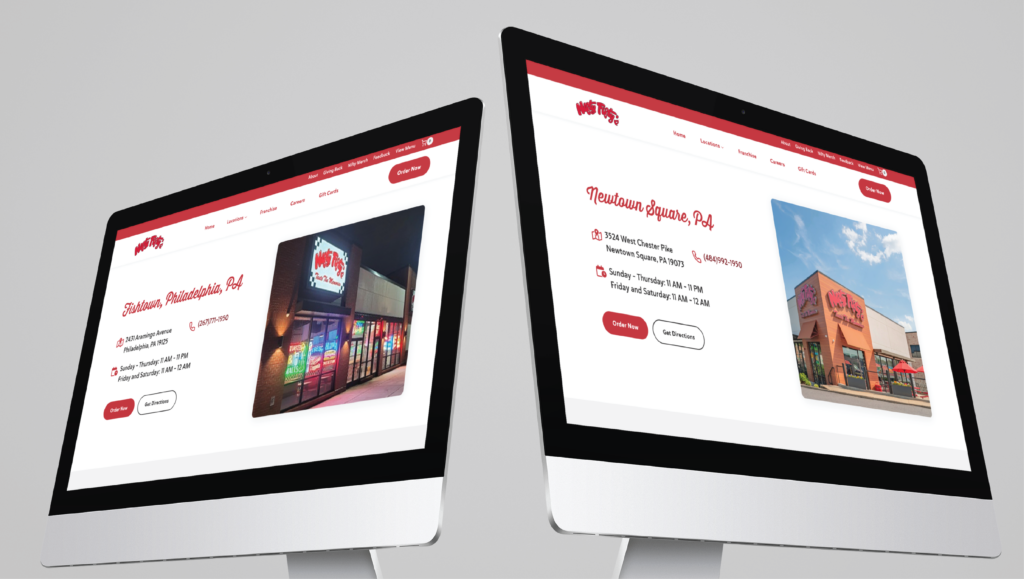 Two computer monitors display web pages for different restaurant locations in Philadelphia PA, each showing an exterior photo, address, phone number, and operating hours on a clean, modern custom website design interface.