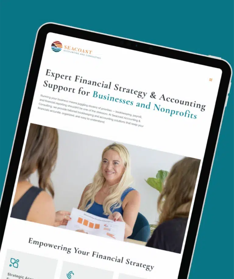 A tablet displays Seacoast Financial’s website for New Hampshire businesses and nonprofits, featuring a heading about financial strategy and accounting support, plus a photo of a smiling woman holding a chart in a meeting.