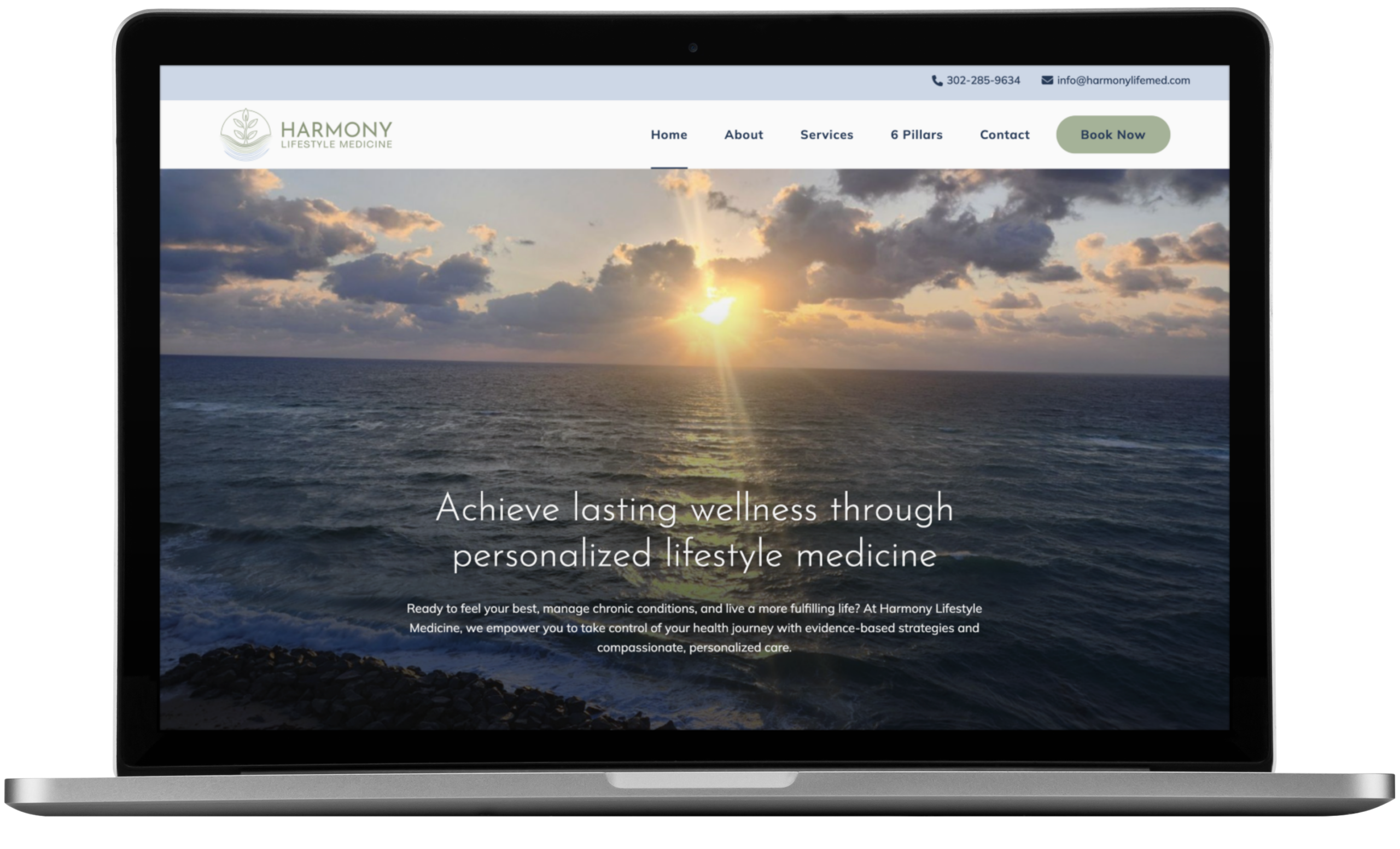 | Moonlit Media LLC A laptop displays the Harmony Lifestyle Medicine website, showcasing thoughtful website design with a sunset over the ocean and text promoting personalized lifestyle medicine by expert lifestyle coaches. Navigation menus and a “Book Now” button are visible at the top.