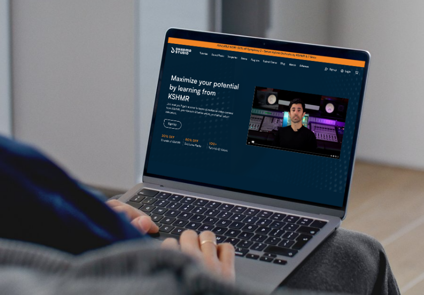 A person uses a laptop displaying a music production course webpage featuring a video of an instructor in a studio setting. The headline reads, Maximize your potential by learning from KSHMR—refine your website structure just like hit tracks.