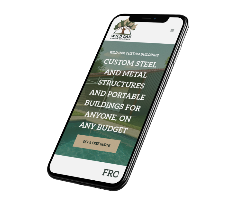 A smartphone displaying the Wild Oak Custom Buildings website design, featuring text about custom steel and metal structures and portable buildings, with a green Get a Free Quote button on the screen.