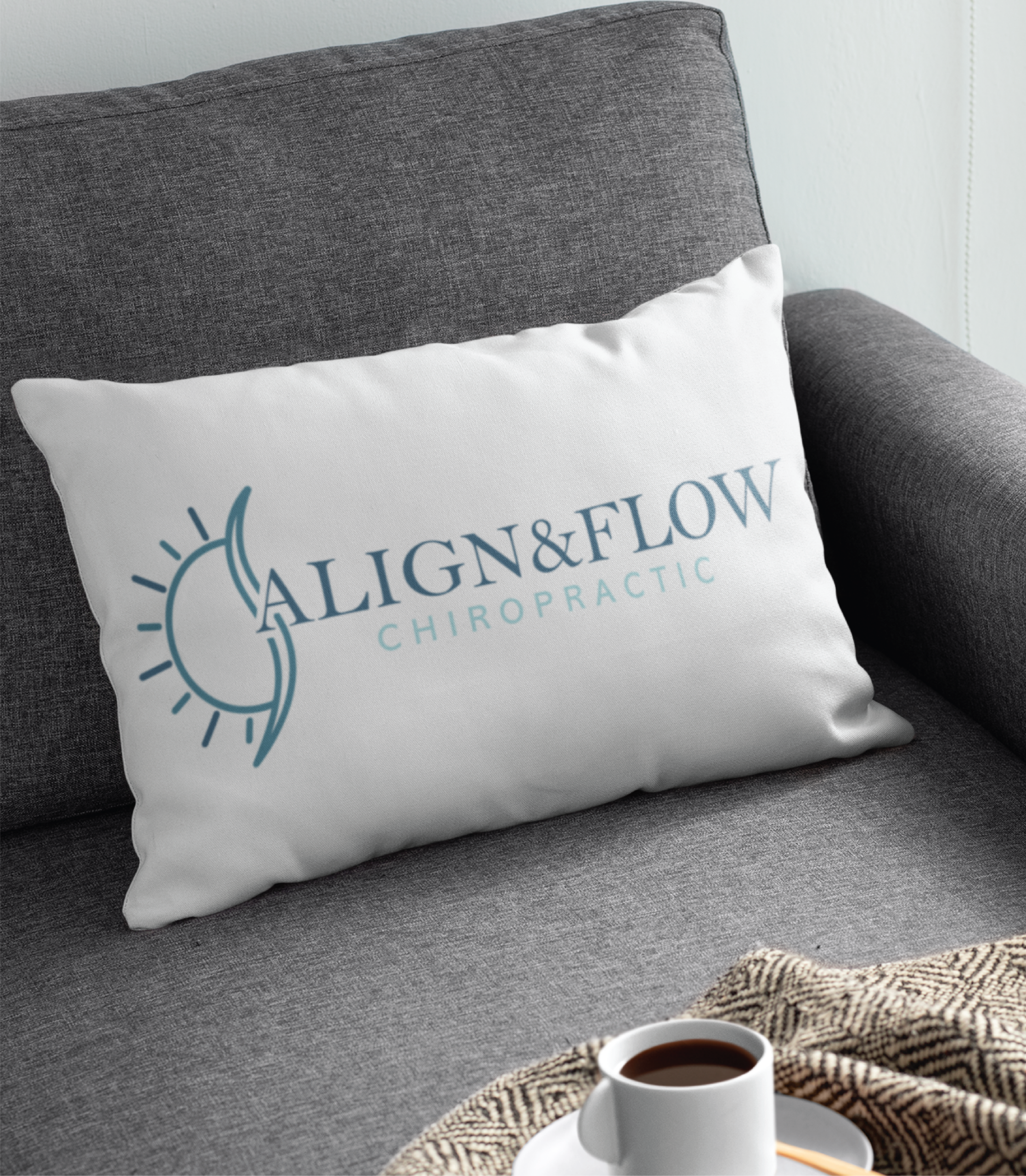 The-Pitfalls-of-Designing-Logos-on-Canva | Moonlit Media LLC A modern, bright office with wooden floors, large windows, and minimalist furniture. A computer sits on a desk with a chair—perfect for custom website design or logo design services from Moonlit Media. Framed artwork and plants complete the scene.