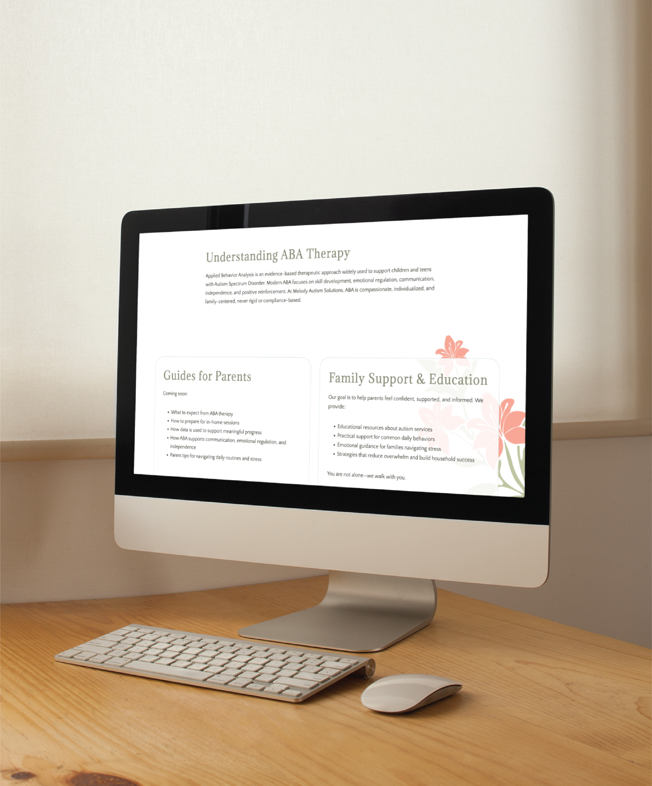 A computer on a wooden desk in Philadelphia, PA displays a custom website design titled “Understanding ABA Therapy,” featuring guides for parents and family support and education, with decorative floral accents on the screen.