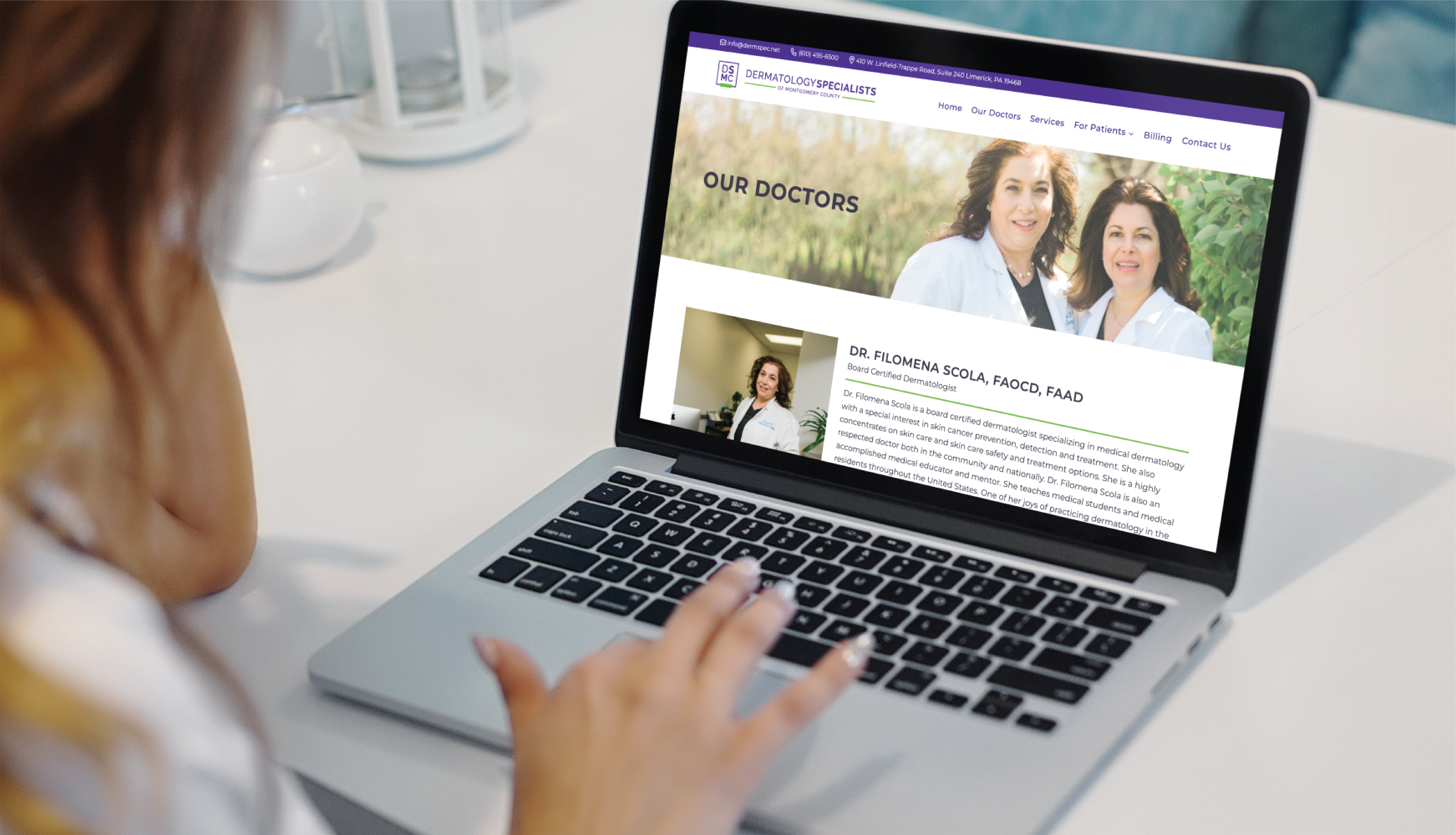 A person using a laptop views a medical practice website featuring a well-designed "Our Doctors" page with photos and information about Dr. Filomena Scola Facci, serving patients in Pennsylvania.