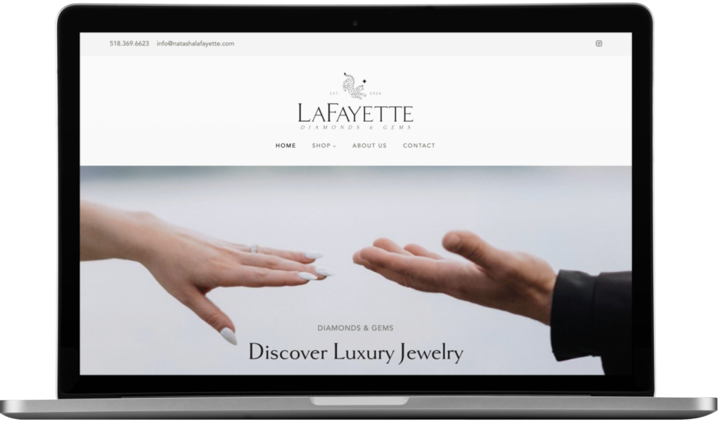 A laptop displays the Lafayette Diamonds & Gems website, designed in New York, featuring two hands reaching toward each other above the text Discover Luxury Jewelry. The site header and navigation menu are visible.