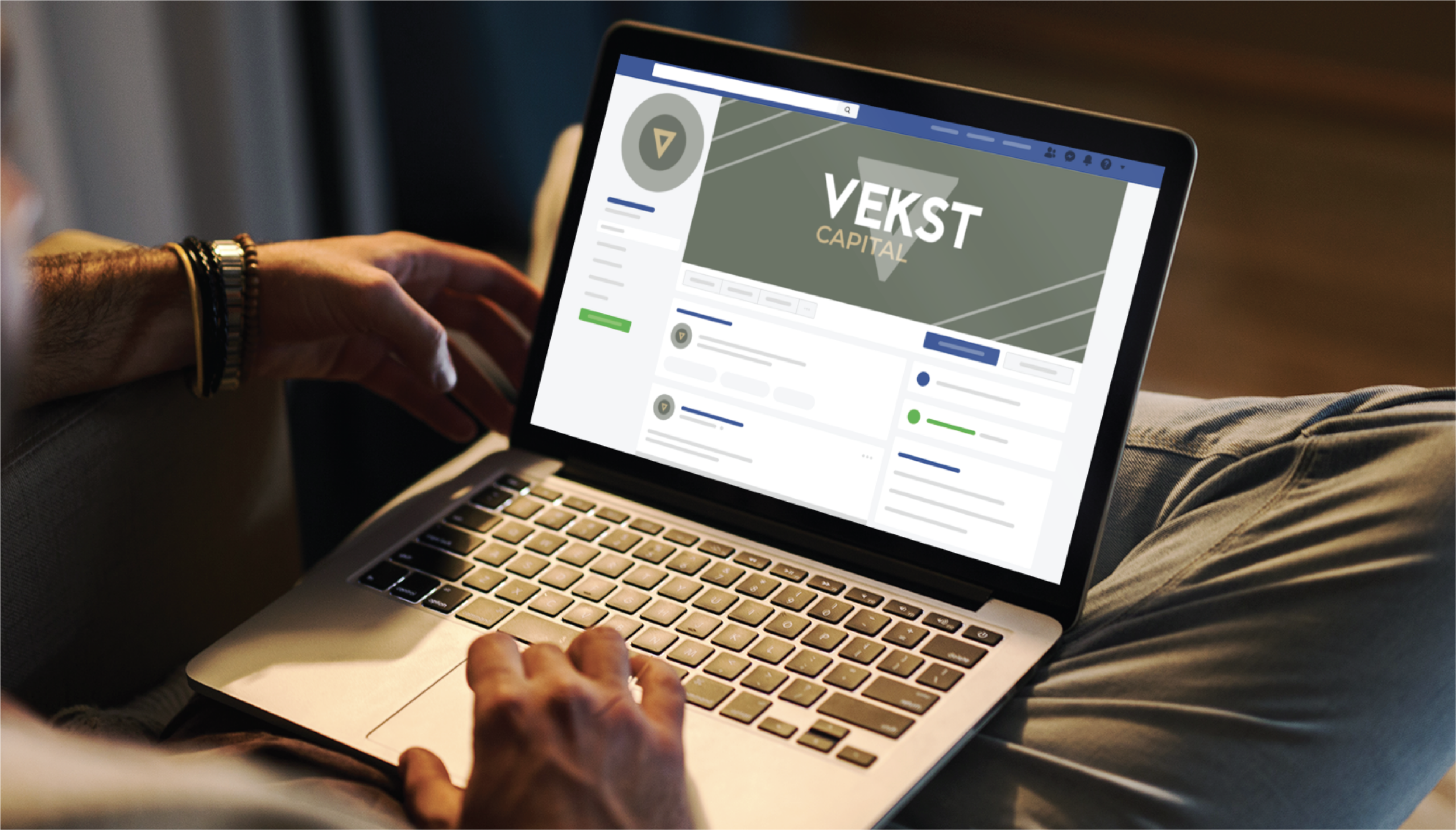 A person using a laptop views a social media profile page for Vekst Capital, featuring Web Design elements like a sleek logo and banner. The individual is seated, with one hand on the laptop’s keyboard.