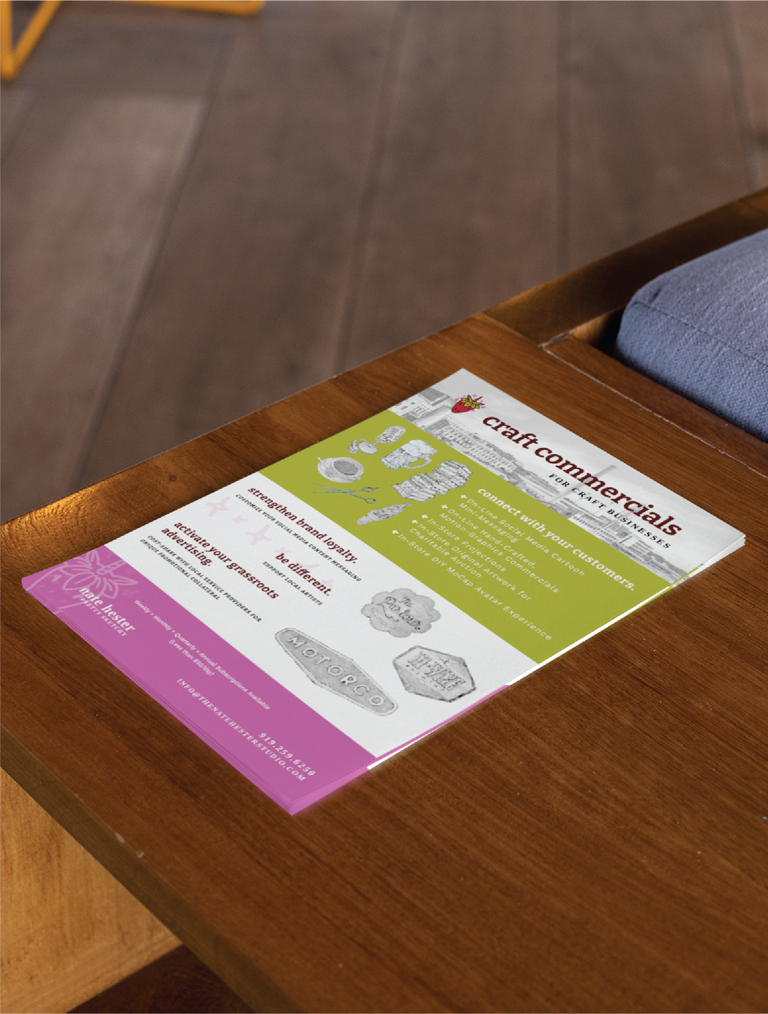 A colorful flyer titled Craft Commercials lies on a wooden table next to a cushioned seat. Featuring white, green, and purple sections, it promotes craft-related services like Business Card Creation and Life Coach sessions in Tennessee.