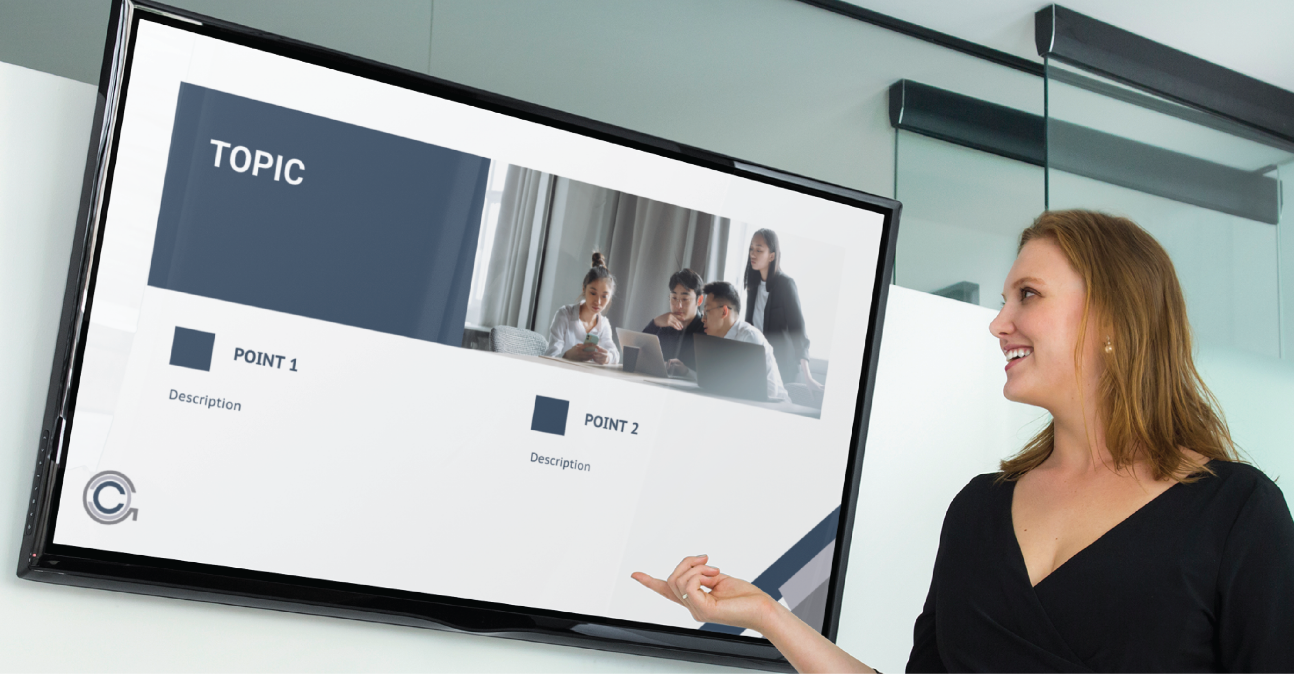 A woman in business attire stands and points at a large screen displaying a well-crafted slide deck design titled “TOPIC,” featuring points on HR Management and a group photo of people working together, possibly at an event in Minnesota.