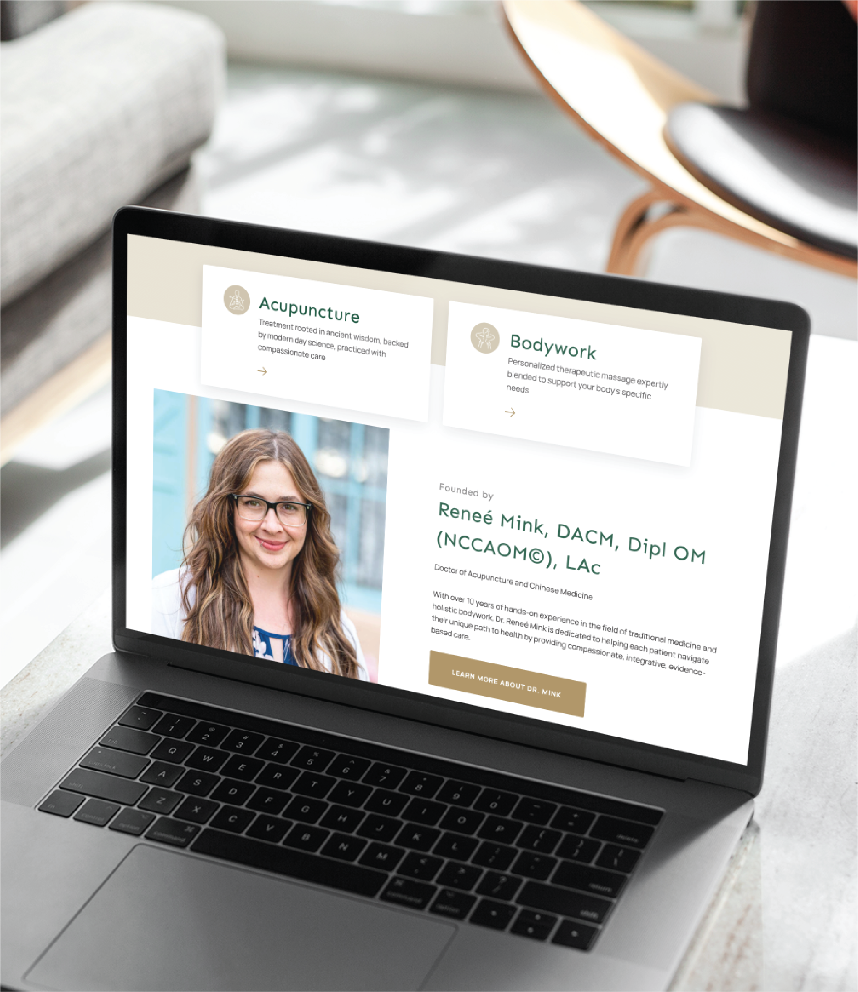 A laptop on a desk displays a website for Renee Mink, DACM, in Florida, featuring sections on acupuncture and bodywork, plus a smiling woman with long brown hair and glasses—a great example of professional website creation.