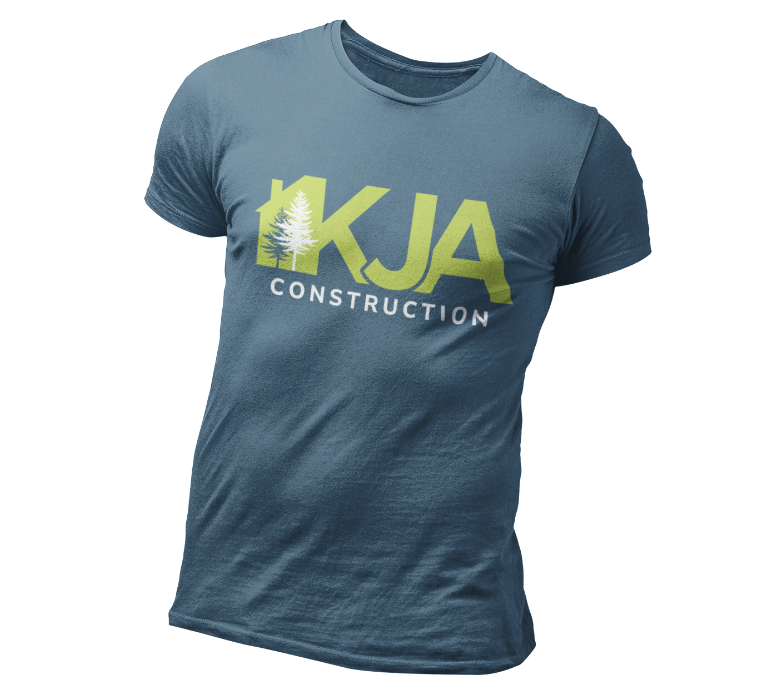 A blue t-shirt featuring the text KJA CONSTRUCTION in bold letters, with a tree graphic integrated into the letter K—a standout piece for fans of construction branding and unique construction logo design.