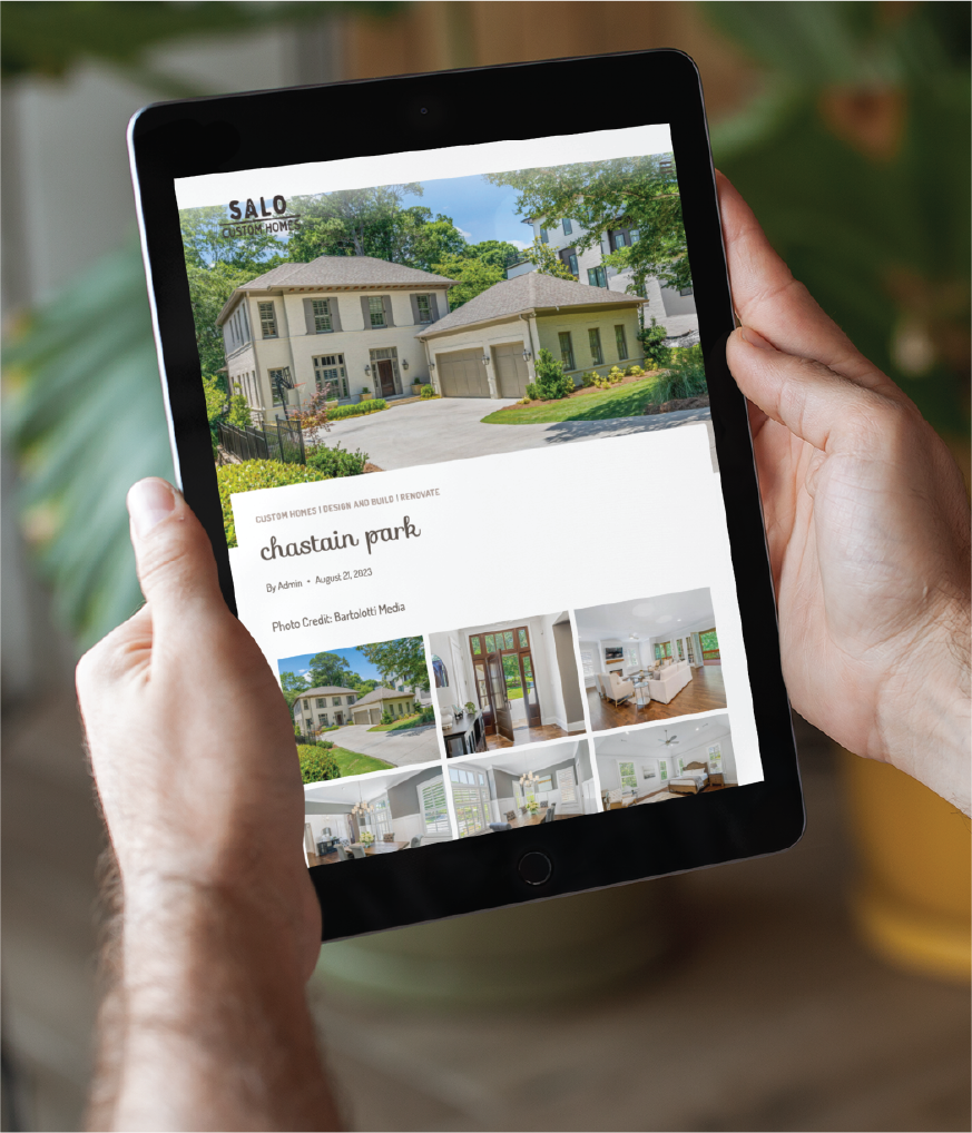 A person holds a tablet displaying an article about Chastain Park with images of a modern California house, stylish interiors, and lush greenery. The website shown is SALO, featuring home design photos.