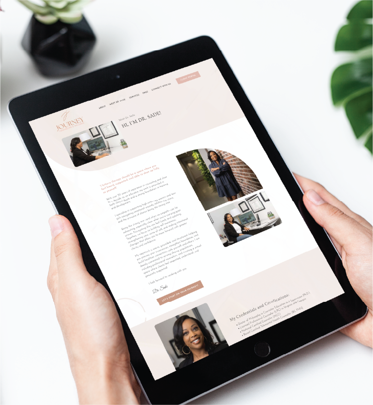 A person holds a tablet displaying a website profile for Dr. Sayde, featuring her introduction, credentials, and photos of her in professional and casual settings. Web design elements highlight her Georgia practice. A plant and notebook are partially visible in the background.