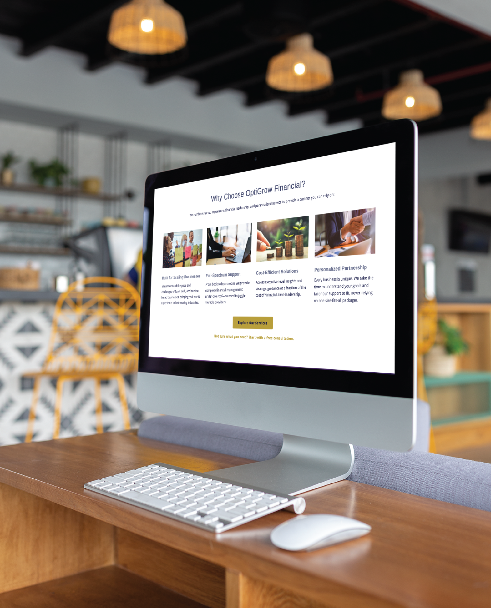 Desktop computer on a wooden desk showing a business website with a'Why Choose OptiGrow Financial?' page and image tiles in the content area