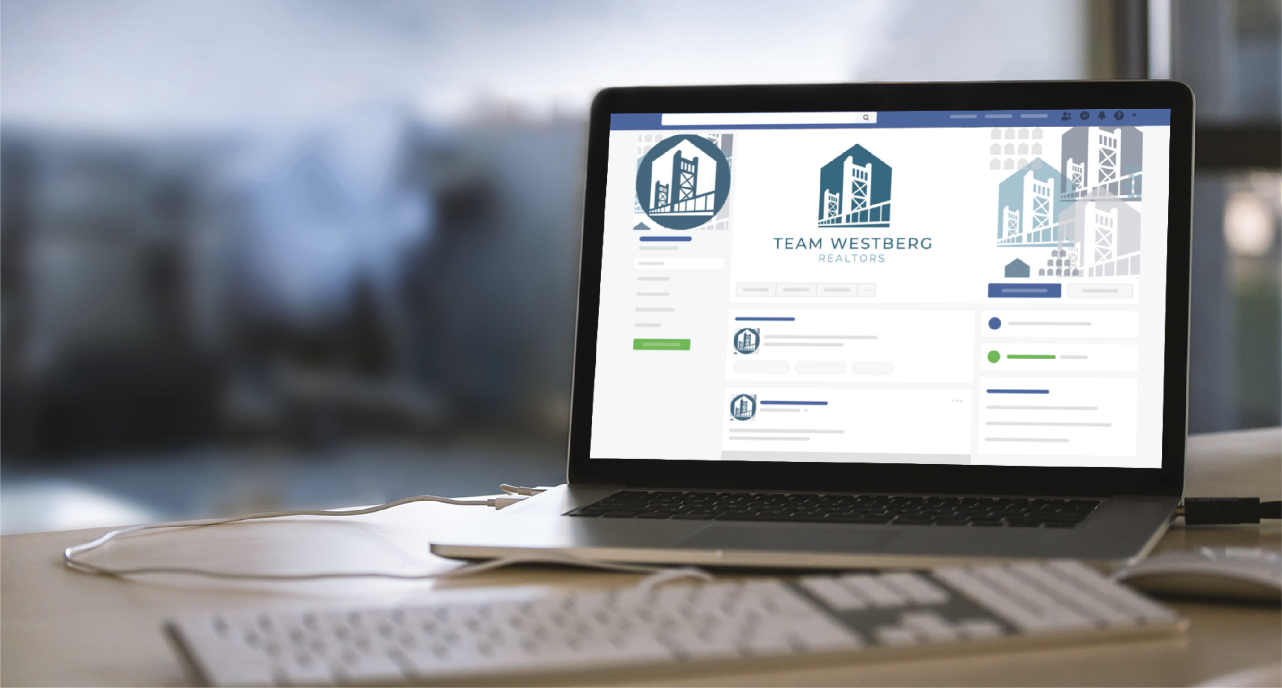A laptop on a desk displays a California realtors team's social media profile page featuring city buildings in their logo. A keyboard and mouse are in front, with social graphics and a blurred office background visible.