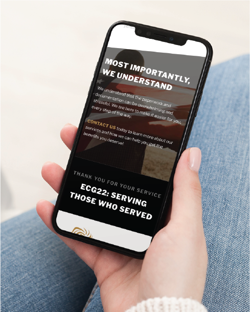 A person in blue jeans holds a smartphone displaying a custom website design for “ECG22: Serving those who served,” with the heading “Most importantly, we understand.” This Texas-based site highlights specialized counseling services.