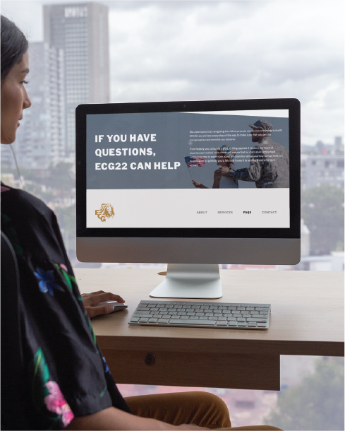 A woman sits at a desk by a window in Texas, viewing a computer screen displaying “IF YOU HAVE QUESTIONS, ECG22 CAN HELP,” promoting counseling services with a photo of people talking outdoors. A cityscape is visible outside.