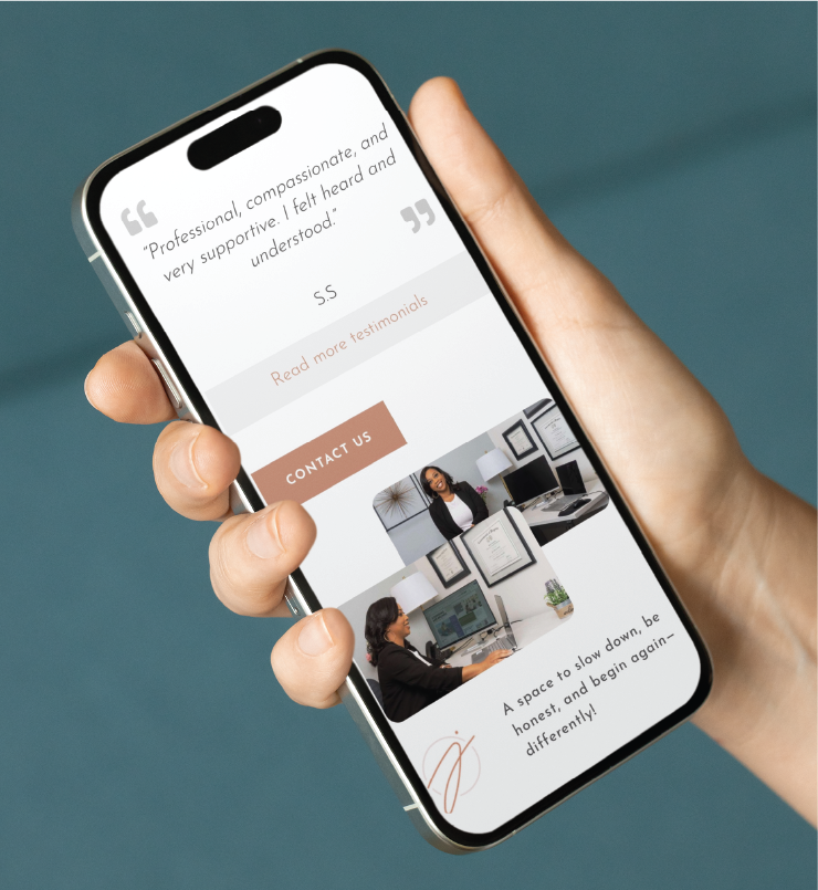 A hand holding a smartphone displays a custom website design for Georgia counseling services, featuring a testimonial, images of a woman at a desk, and a button labeled Contact Us.