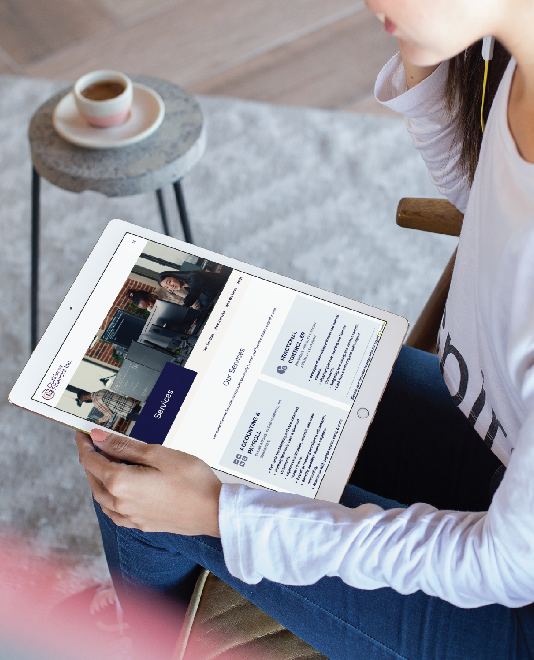A person sits in a chair holding a tablet, viewing a Texas Veteran Services website with business-related content. A cup of coffee rests on a small table nearby. The person wears a white long-sleeve shirt and blue jeans.
