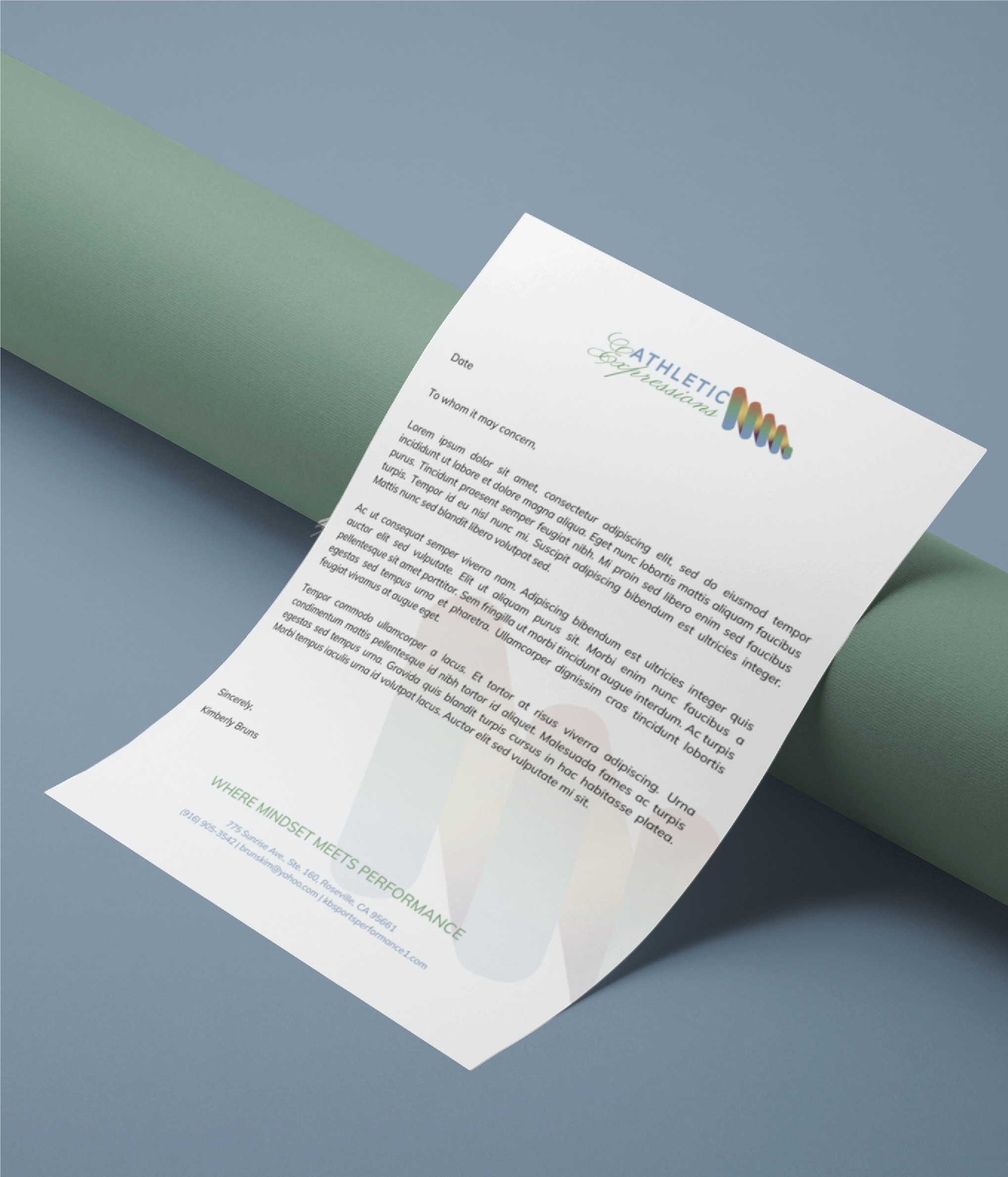A letter on white paper with the ATHLETIC logo, placed over a green cylindrical object, on a gray surface. The text appears formal and uses a blue font at the bottom, resembling the clean style often found in professional business cards. The content is mostly unreadable.