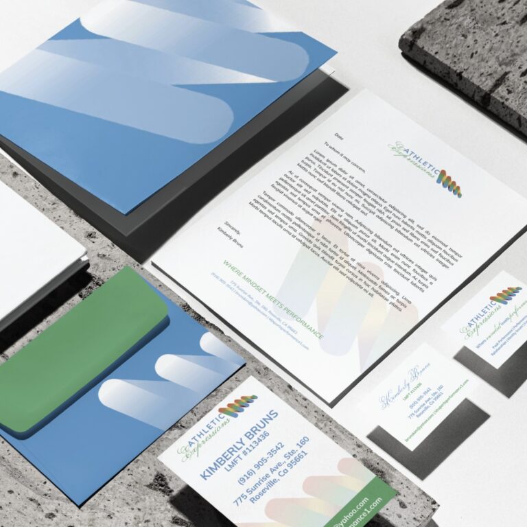 A stationery set with blue and green accents includes letterheads, envelopes, business cards, and folders, all featuring a modern logo with overlapping shapes inspired by Sports Performance Coaching in California. This striking stationery design is arranged neatly on a stone-like surface.