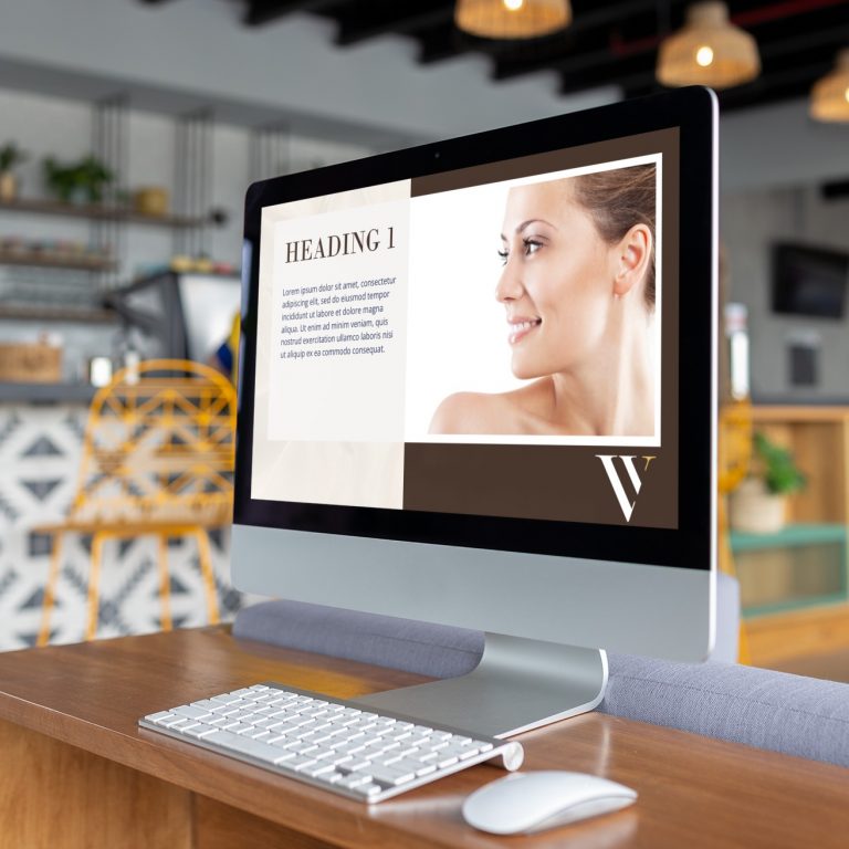 A desktop computer displays a website with a woman’s profile photo, a heading, and text—featuring modern social media design elements. The computer is on a desk in a stylish Indiana workspace, with shelves and chairs in the background, creating an inviting environment ideal for an accounting service.