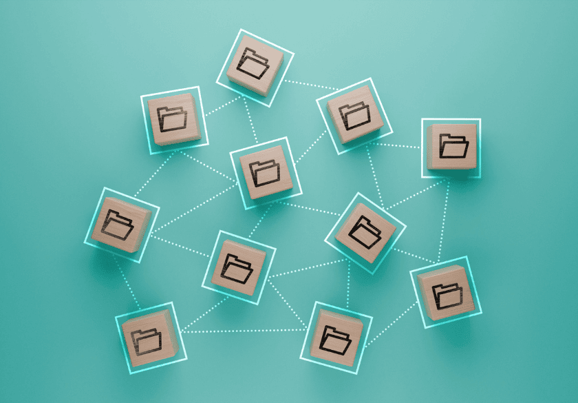 Twelve wooden tiles with folder icons are connected by dotted lines on a teal background, representing organized networked data sharing or distributed file systems—ideal for small businesses to efficiently manage and access brand assets.