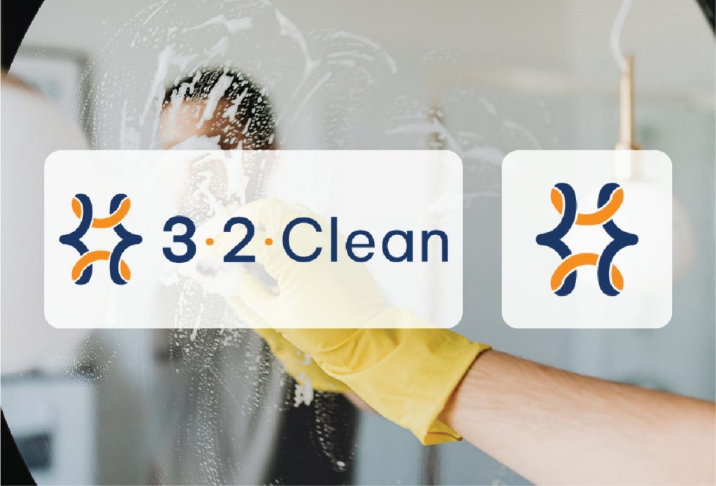 A person in a yellow glove cleans a glass surface with soap. Overlaid are the logo and name 3•2•Clean in blue and orange, reminiscent of the vibrant colors found throughout New Orleans. Another logo appears to the right, adding a polished touch that would stand out on any website design.
