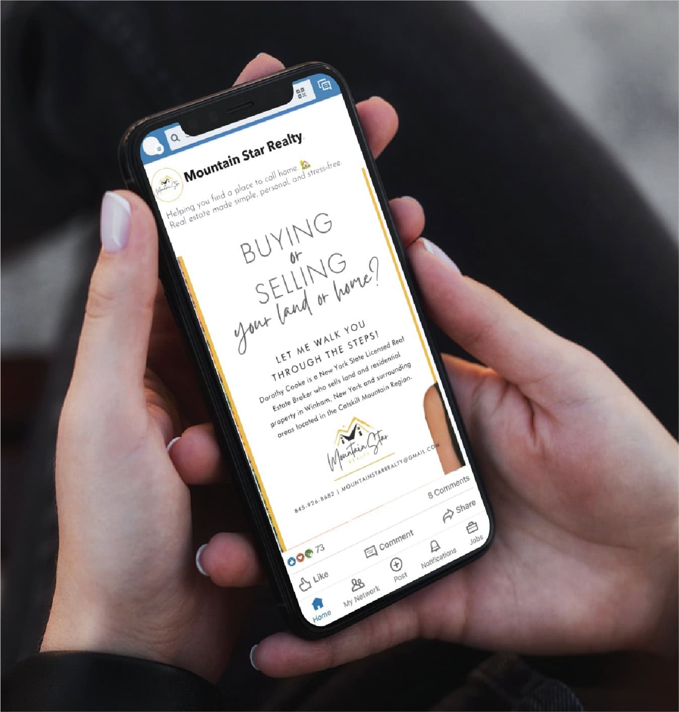 A person holds a smartphone displaying a Mountain Star Realty ad with custom social media design, offering help with buying or selling homes in Michigan, against a blurred background.